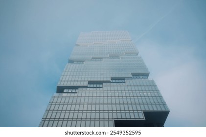 foggy construction site of a modern office building in the sky - Powered by Shutterstock