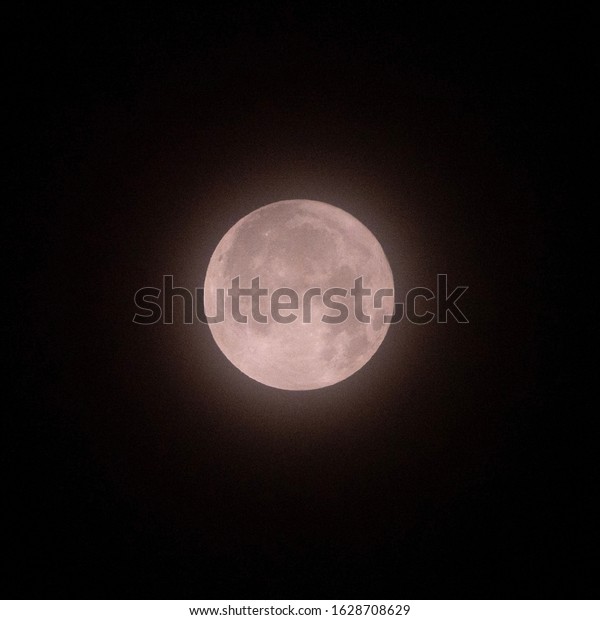 Foggy full moon in the\
dark