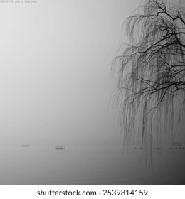 Foggy lakeside scene with distant boats and leafless tree branches creating a tranquil atmosphere. Chinese word means Title or signature. - Powered by Shutterstock