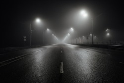 Foggy Misty Night Road Illuminated By Street Lights