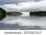 A foggy morning on Lake Clark in Alaska. Port Alsworth and Hardenburg Bay in Lake Clark National Park and Preserve. Inverted cloud layer, inversion layer, low visibility.