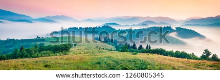 Foggy morning panorama of mountains valley. Splendid summer sunrise in Carpathian mountains, Rika village location, Transcarpathian, Ukraine, Europe. Beauty of nature concept background.