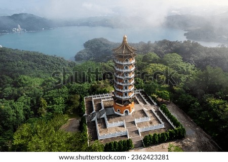 Foggy mourning at the Ci En Pagoda at Sun Moon Lake was built by Chiang Kai-shek in memory of his mother, Nantou County, Taiwan. Stock fotó © 
