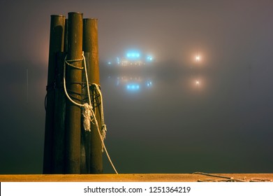 Foggy Night At The Incoming Docks Of A Safe Harbor In The Outer Banks For Boats Seeking Safety From Unsafe Conditions In The Atlantic Ocean.