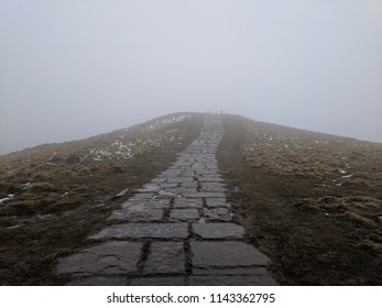 Foggy paved path