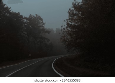 Foggy road, car drives on highway in fog , view throug windshield, in day time. Very poor road visibility. - Powered by Shutterstock