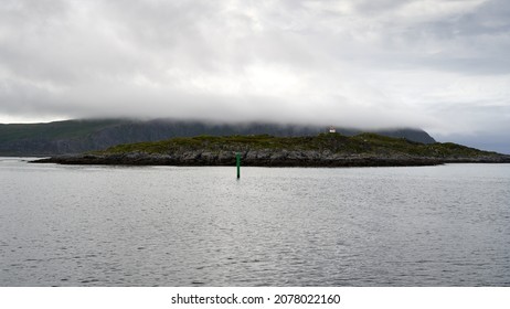 A foggy seascape from northern Norway with a lighthouse, close to Nordkapp