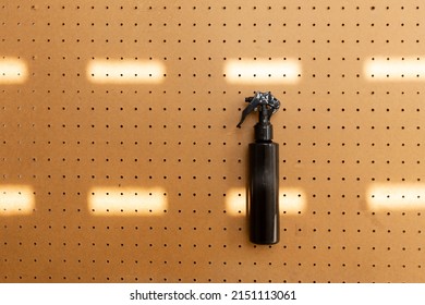 Foggy Spray Bottle On Peg Board.