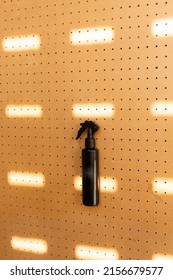 Foggy Spray Bottle On Peg Board.