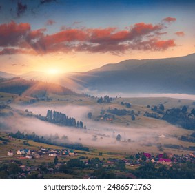 Foggy summer sunrise in Lozaschina village. Misty morning scene of Carpathian mountains, Ukraine, Europe. Dramatic dawn scene of mountain valley. Beauty of countryside concept background. - Powered by Shutterstock