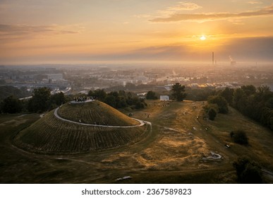 Foggy sunrise over Krakus Mound in Krakow, Poland during Welcome to summer event.