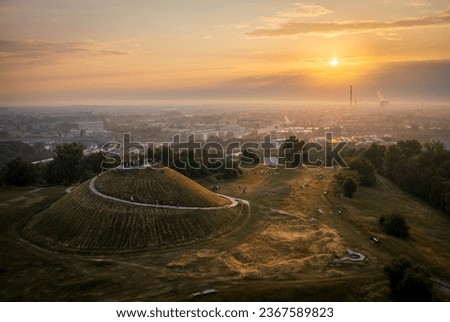 Foggy sunrise over Krakus Mound in Krakow, Poland during Welcome to summer event.