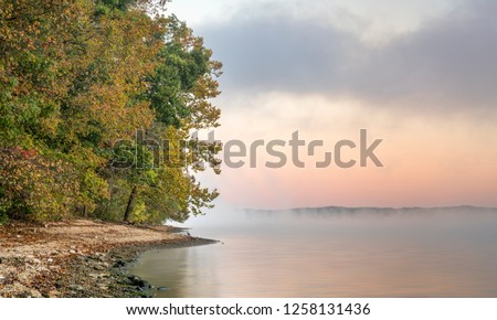 foggy sunrise over water - Tennesse River at Natchez Trace Parkway