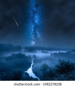Foggy valley at night with milky way and stars. Wildlife at night in Poland.