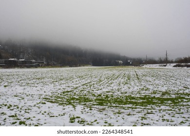 The foggy winter landscape near Ossiacher See Lake in Carinthia, Austria. Located in the southern Nock Mountain range of the Gurktal Alps near Villach