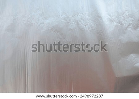 Foil background. Silver foil texture. Crumpled foil paper.