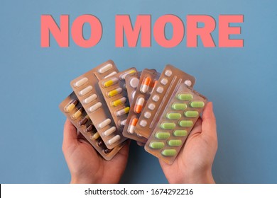 A Lot Of Foil Packages With Different Pills On Young Female Hands With Red Words 