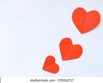 Fold Paper Red  Hearts {Paper Heart Cutting}, Heart Of Paper Folding Isolated On White Background. Cards For Valentine's Day There Is Space For Text 