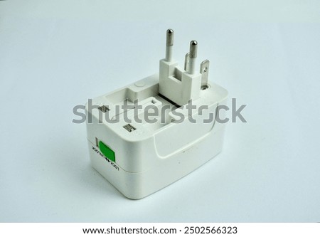 Foldable electrical plug with multiple plug types. Item to carry while traveling. Object photography isolated on white background.