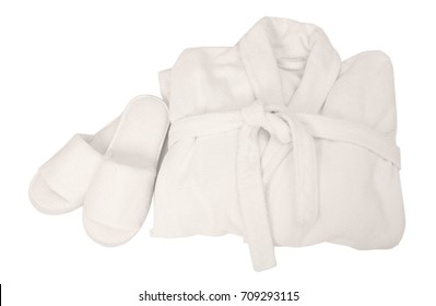 Folded Bathrobe And Bathing Slippers On White Background