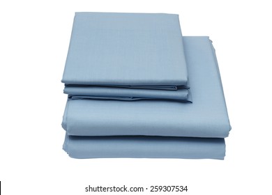 Folded Bed Linen Or Duvet Cover On White Isolated Background