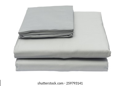 Folded Bed Linen Or Duvet Cover On White Isolated Background