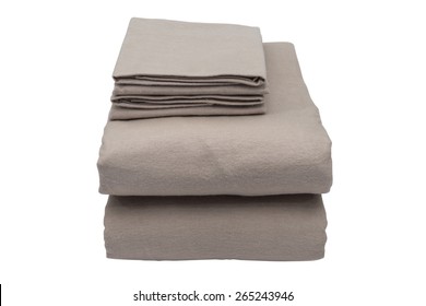 Folded Bed Linen Or Duvet Cover On White Isolated Background