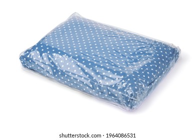 Folded Bedding Set In Plastic Storage Bag Isolated On White