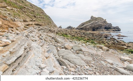 Folded Beds Of Purbeck And Portland Limestone Cropping Out At Mupe On Dorset's Jurassic Coast. 