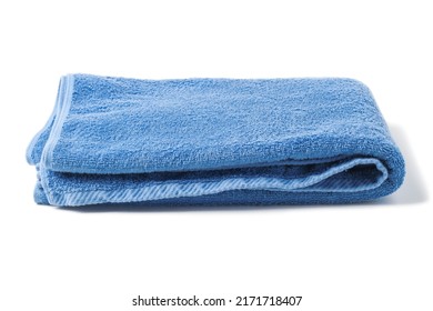 Folded blue bath terry towel isolated on white
