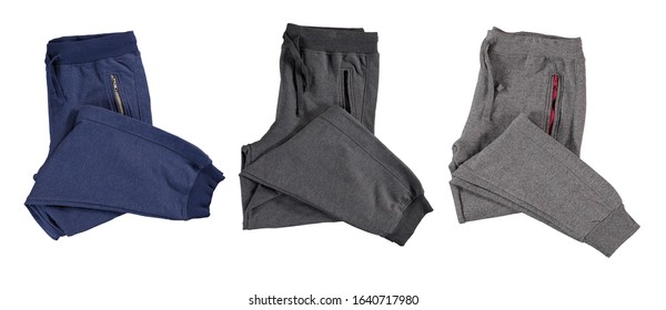 Folded Blue And Gray Jogging Pants. Isolated Image On A White Background. Set.