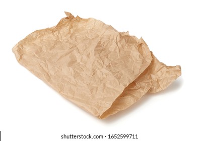 folded brown crumpled sheet of parchment paper isolated on white background, element for designer
