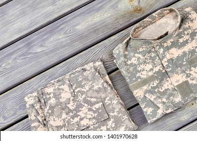 Folded Camouflage Jacket And Pants. Close Up, Top View.