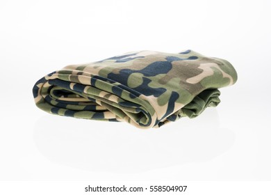 Folded camouflage pants on isolated white background.
