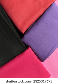 Folded clothes are kept side by side.
