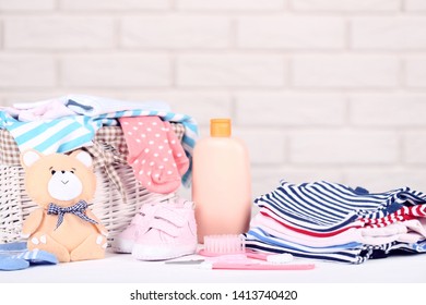 Folded Clothes With Soft Bear Toy And Baby Supplies