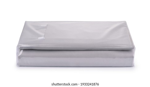 Folded Grey Cotton Bedding Sheets In Clear Plastic Bag Isolated On White