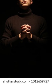Folded hands in prayer
