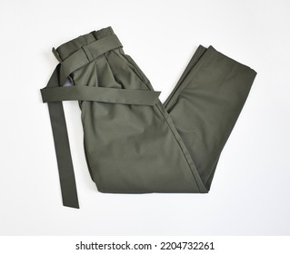 Folded Khaki Green Pants With Belt Side View On White Background