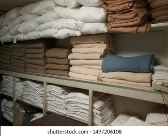 Folded Linens In A Large Laundry Room