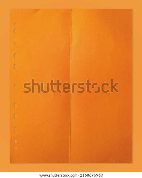 folded orange divider
sheet isolated on orange paper background. cool paper overlay or
poster element.