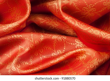 Folded orange fabric with Indian ornament