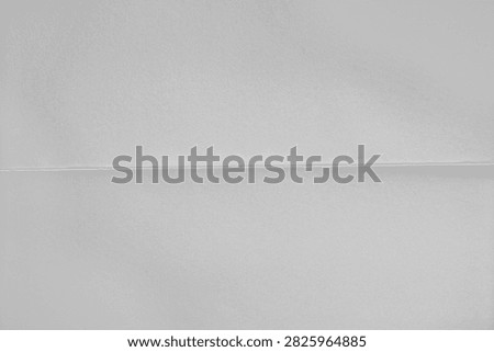 Folded paper texture with subtle single horizontal crease