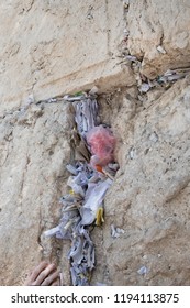 Folded Prayers In Jerusalem's Western Wall