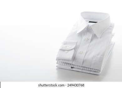 Folded Shirts On  White Background