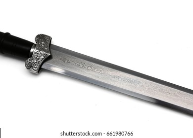 Folded steel Chinese sword's blade on white background. Layers of steel