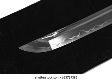 Folded steel with hamon (Clay tempered line for harden) Blade of Japanese sword  (Chinese made) on white background
