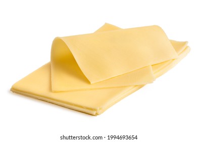 Folded Thin Slice Of Yellow Cheese On Top Of A Stack Of Yellow Cheese Slices.