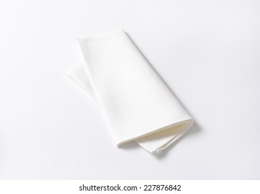 Folded White Napkin On White Background