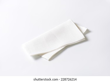 Folded White Napkin On White Background